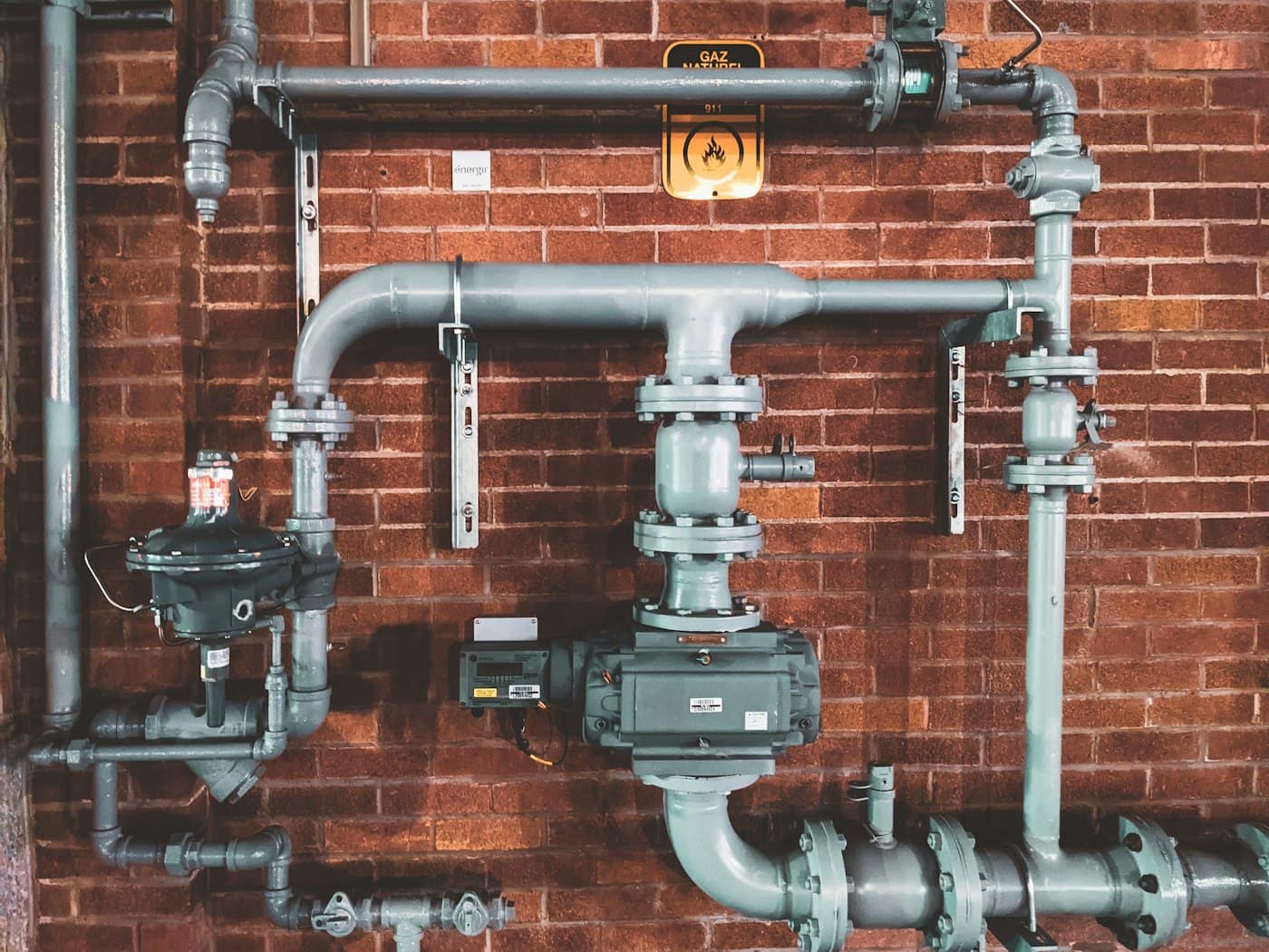 Plumber working on residential piping